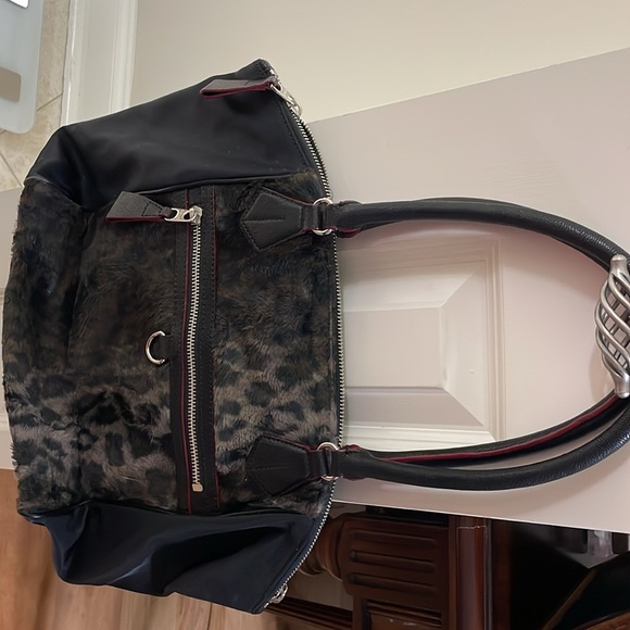 Leopard print with the feel of fur.MZ Wallace purse.Red trim with black handles. - Picture 2 of 7